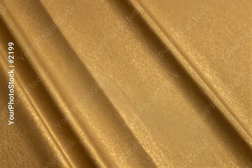 Gold Textured Fabric Close-Up metallic shiny diagonal