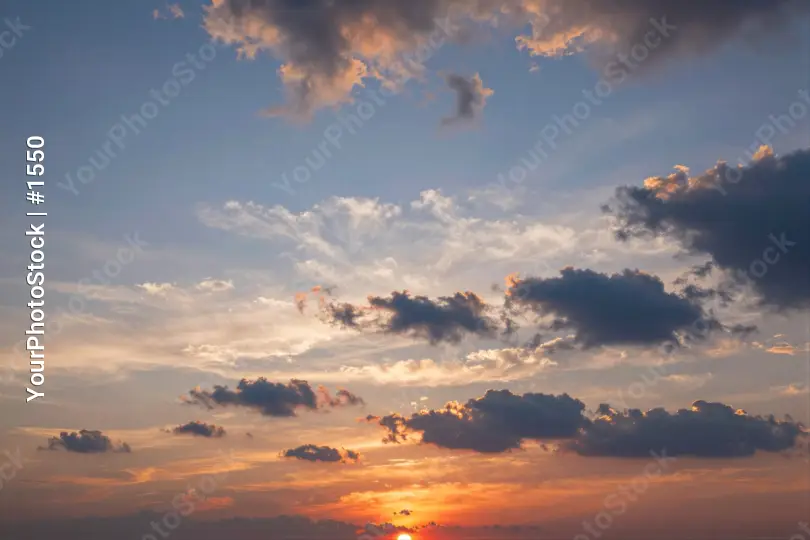 Serene Sunset with Fluffy Clouds warm horizon