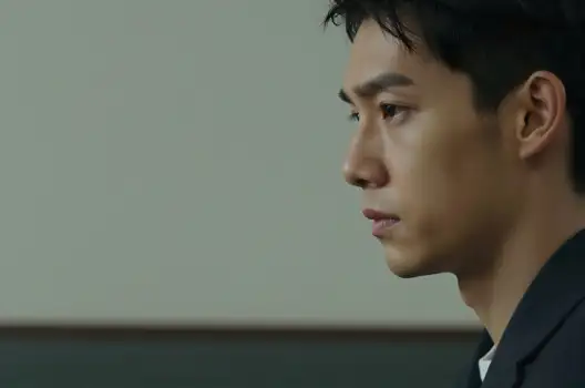 Young Man in Serious Suit Looking Intently serious expression