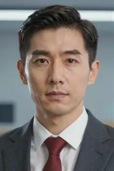 Young Asian Man in Dark Suit Looking Serious serious expression business