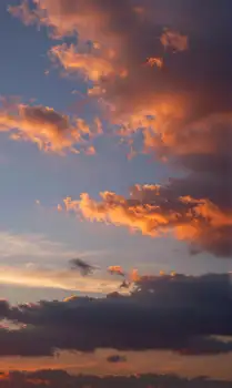 Sunset with Vibrant Colors Over Scattered Clouds