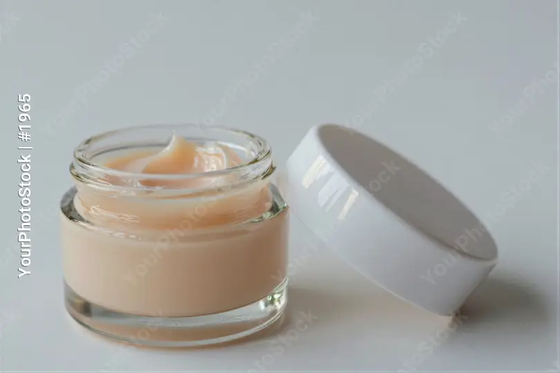 Light Beige Cream in Open Jar lotion glass lid