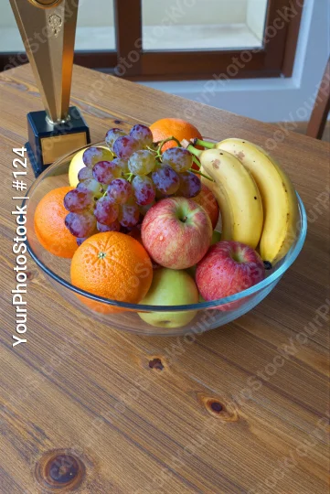 Fresh Fruits Bowl with Trophy on Wooden Table