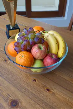 Fresh Fruits Bowl with Trophy on Wooden Table