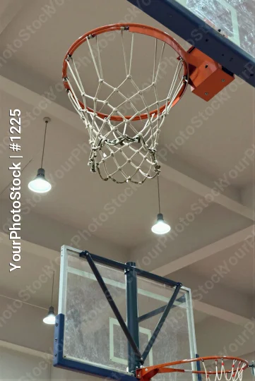 Basketball Hoop Hanging From Ceiling In Gymnasium