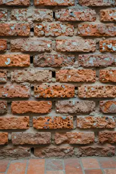 Weathered Brick Wall Close-Up old grid pattern