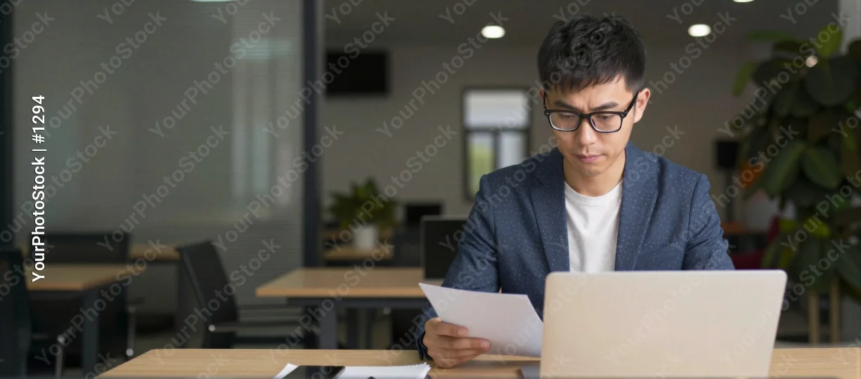 Young man working at modern office desk modern design