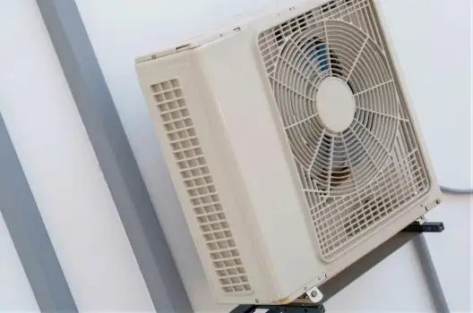 White Air Conditioning Unit on Metal Stand fan