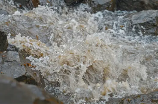 Serene Waterfall Cascading Over Rocky Surface