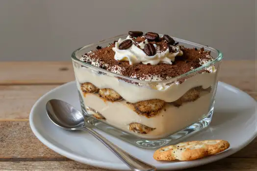 Tiramisu in Glass Dish on White Plate dessert
