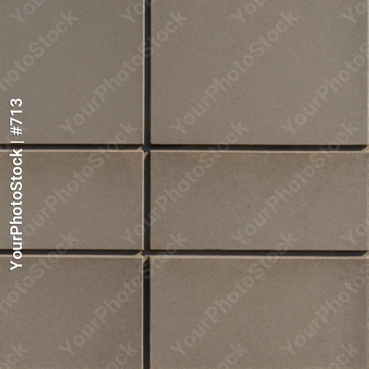 Close-up of a tiled wall with overlapping square tiles