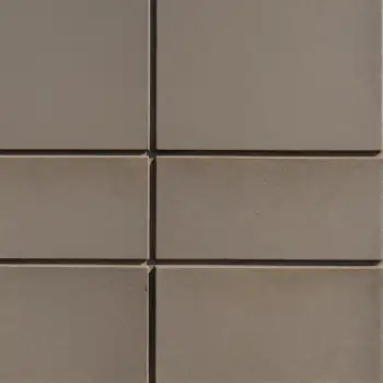 Close-up of a tiled wall with overlapping square tiles