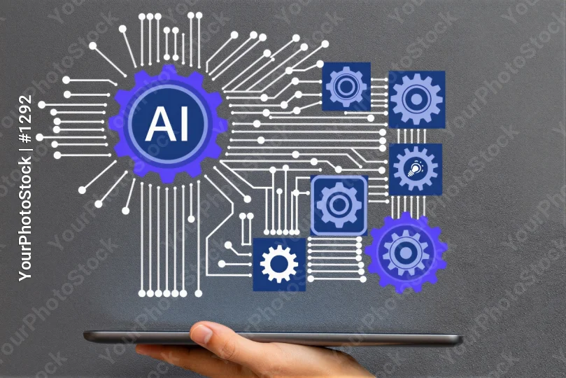Hand holding AI tablet with circuit board and gears