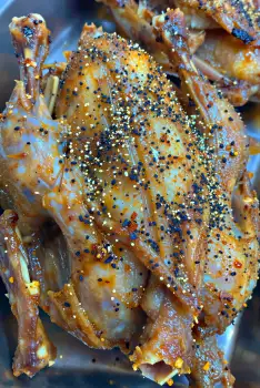 Roasted Chicken Drumsticks Close-Up seasoned black pepper