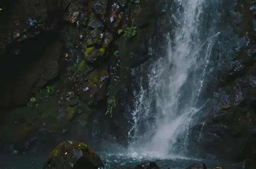 Serene Waterfall Over Rocky Cliff peaceful moss