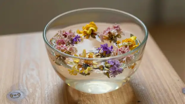 Dried Flowers Floating in Water on Wood glass bowl