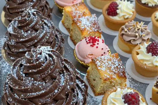 12 Cupcakes and Pastries Arranged on Plate desserts