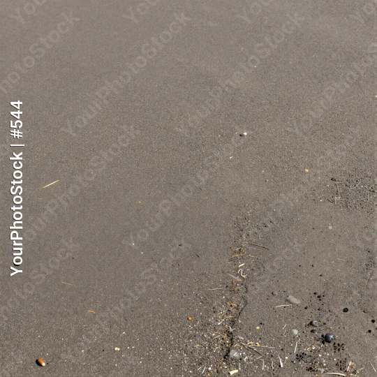 Close-up of Wet concrete asphalt with Pebbles and Rocks