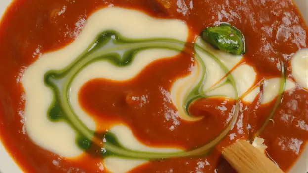 Creamy Tomato Sauce with Swirl of White Cream on Plate