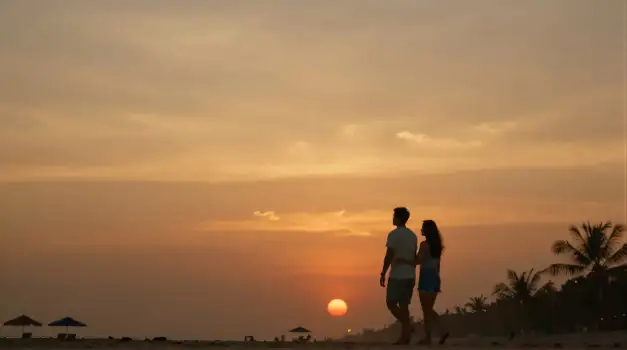 couple walking on beach at sunset romantic peaceful