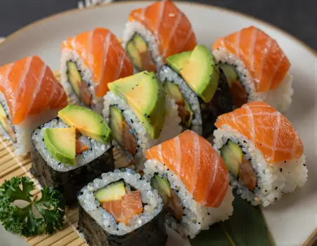 Circular Arrangement of Sushi Rolls on Bamboo Mat