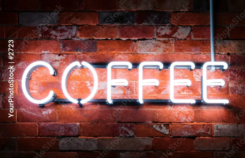 Neon Coffee Sign on Brick Wall
