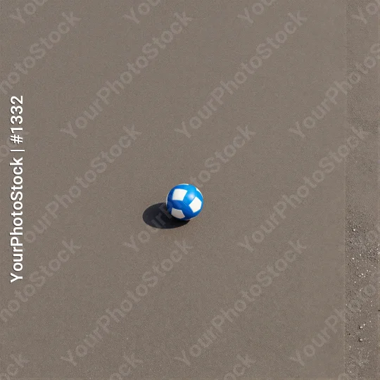 Small Blue and White Plastic Ball Floating on Gray Surface