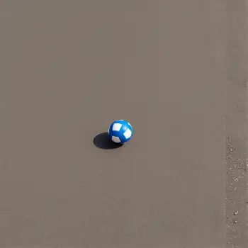 Small Blue and White Plastic Ball Floating on Gray Surface
