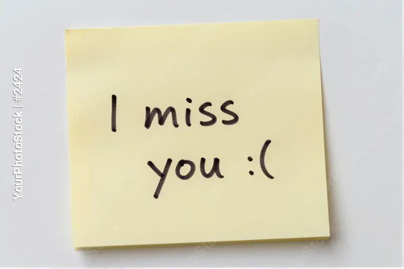 Yellow Sticky Note With Cursive 'I Miss You' Message