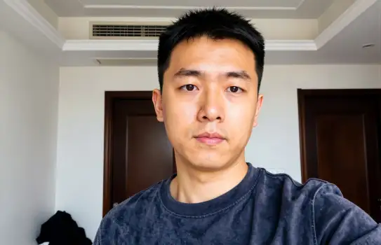 Man in a room taking selfie