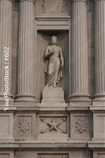 Classical Woman Statue on Building Side pedestal
