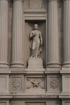 Classical Woman Statue on Building Side pedestal