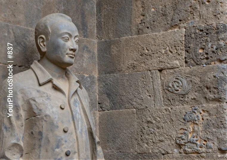 Ancient Stone Statue of Man with Profile Face