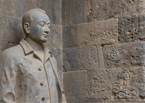 Ancient Stone Statue of Man with Profile Face
