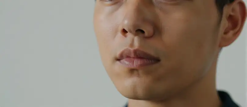Man in deep thought with slight smile close-up