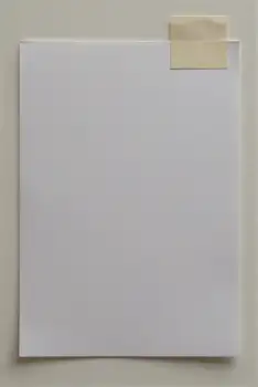 Blank White Paper with Yellow Tape on Wall blank paper sticky note