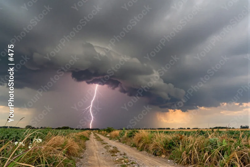 Ominous Lightning Strike on Dirt Road storm field