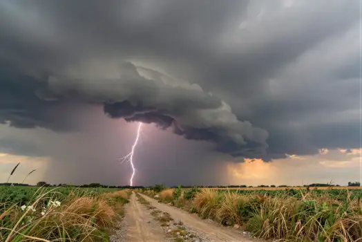 Ominous Lightning Strike on Dirt Road storm field