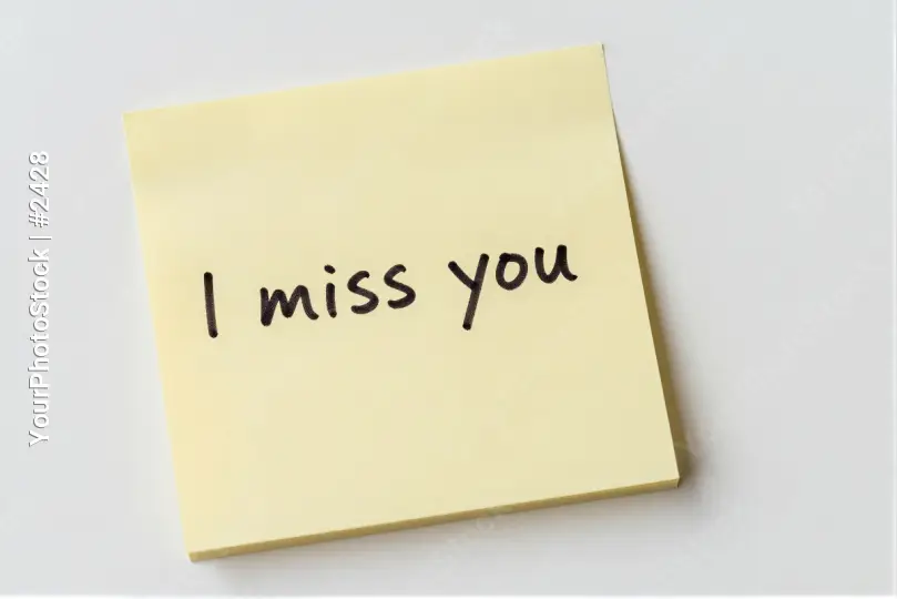 Yellow sticky note with 'I miss you' cursive text