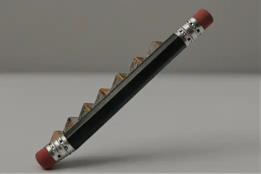 Black Pencil with Red Eraser on White Surface for Growth Startup