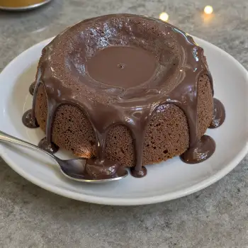 Freshly Baked Chocolate Cake with Drizzle on White Plate