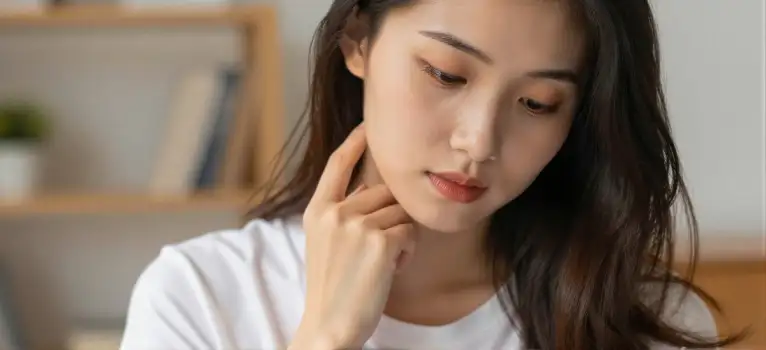 Serene Woman Thinking with Bookshelf contemplative