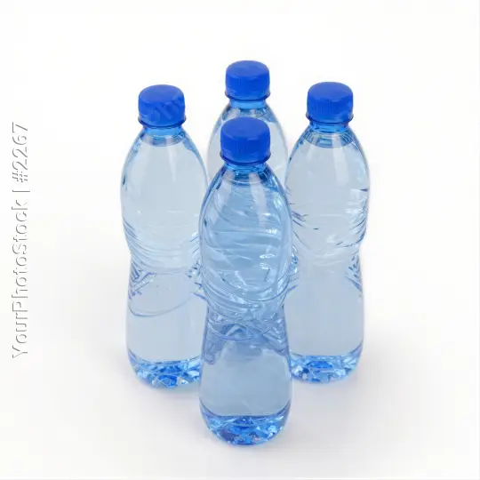 4 Bottles of Water Arranged on White Background