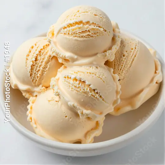 Vanilla Ice Cream Scoops in Bowl with Orange Zest