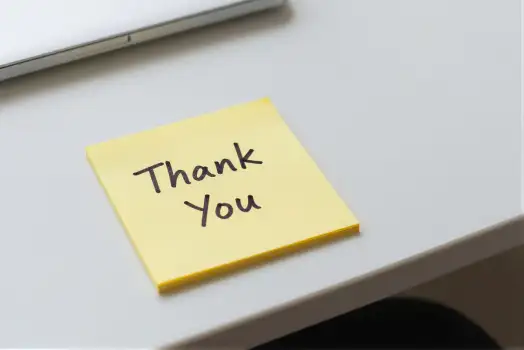 Thank You Note on Desk with Laptop sticky note
