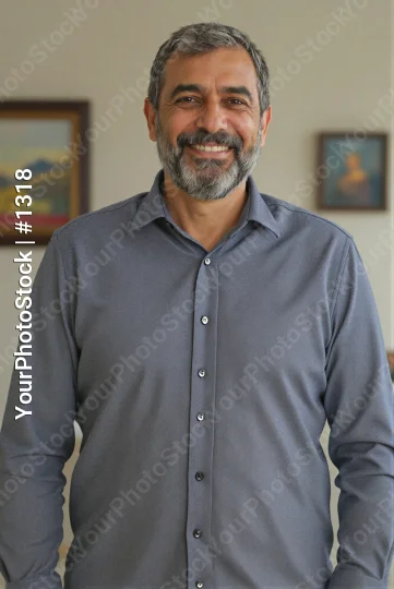 Middle-aged man smiling in office beard mustache business corporate