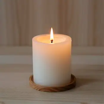 Lit White Candle on Wooden Surface center peaceful