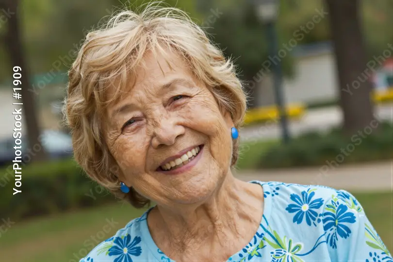 Happy Elderly Woman Smiling in Park happy smile