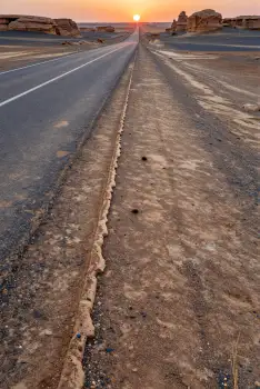 Desert Road at Sunset landscape empty barren hills