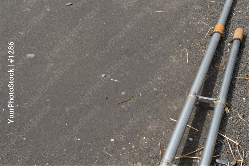 Metal Ladder Against Concrete with Handle